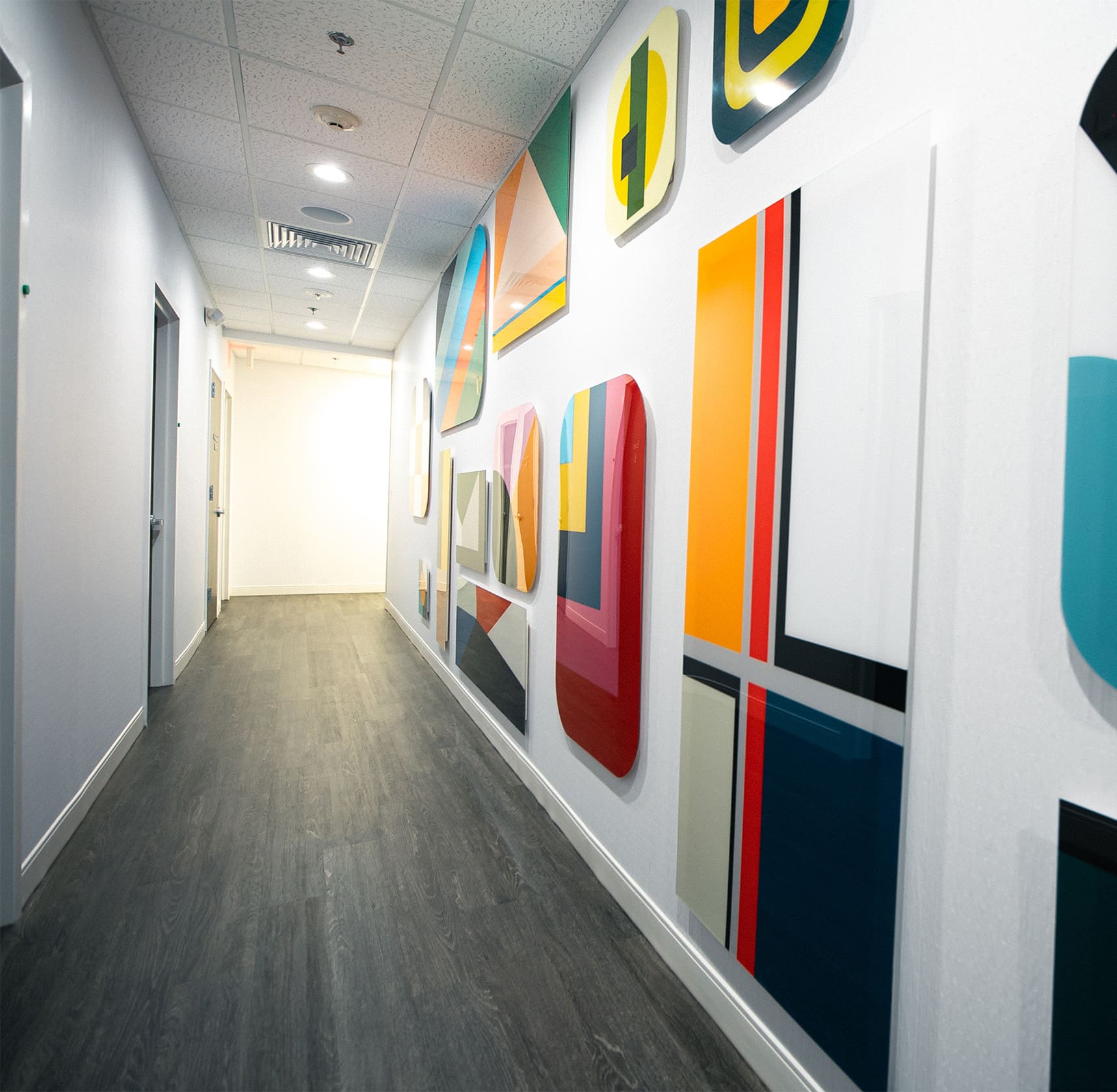 Hallway with artwork on wall